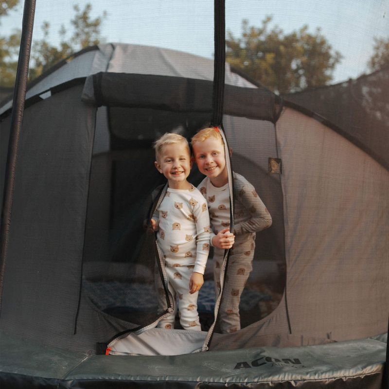 Two kids inside the Acon Trampoline Tent