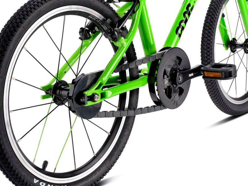 Close-up of a Frog 47 bicycle with chain and gear system on a white background