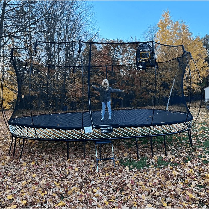 Springfree 12ft x 19ft Jumbo Oval Trampoline with kid playing