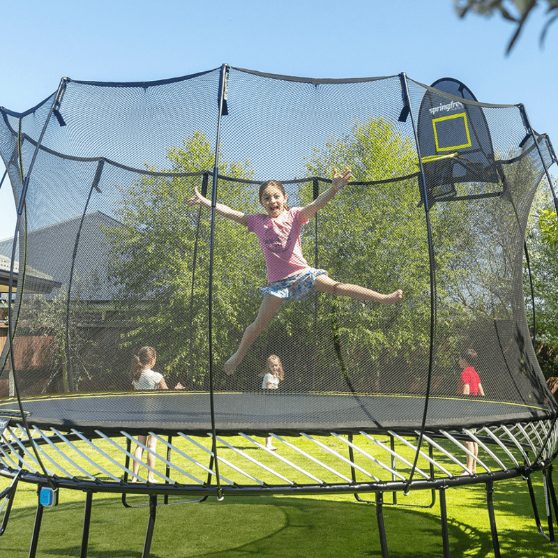 Springfree® 13ft Jumbo Round Trampoline with kids playing and jumping