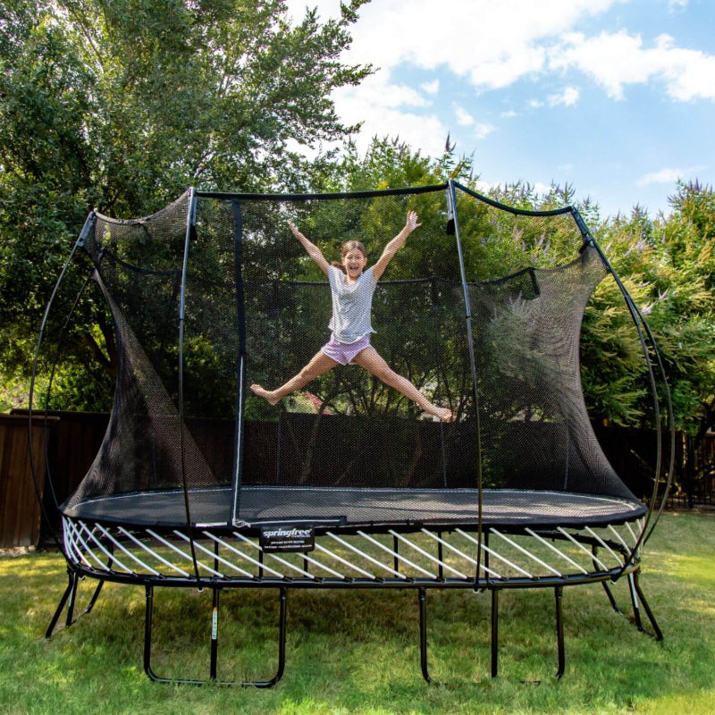 Springfree® 8ft x 13ft Large Oval Trampoline with young girl jumping